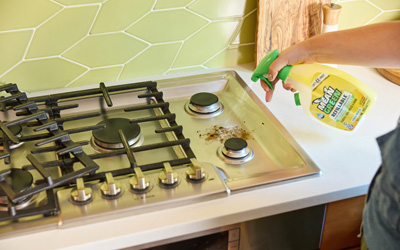 Cooktop being cleaned with degreaser cleaner