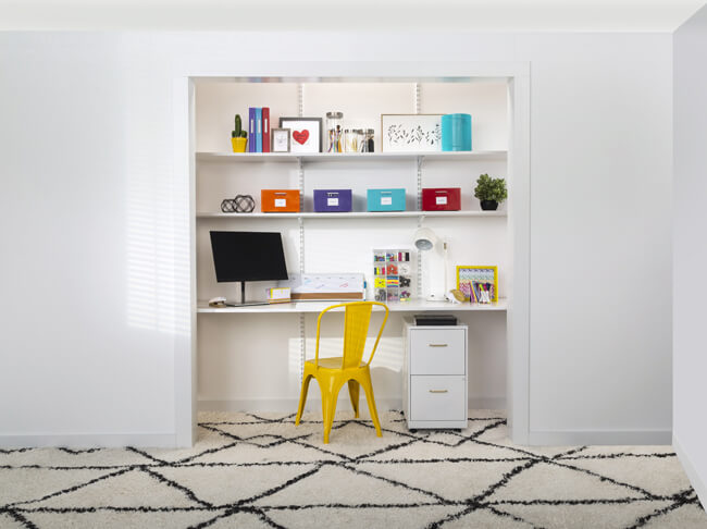 Cloffice with orange, purple, blue and red bins on a shelf and a yellow metal chair.