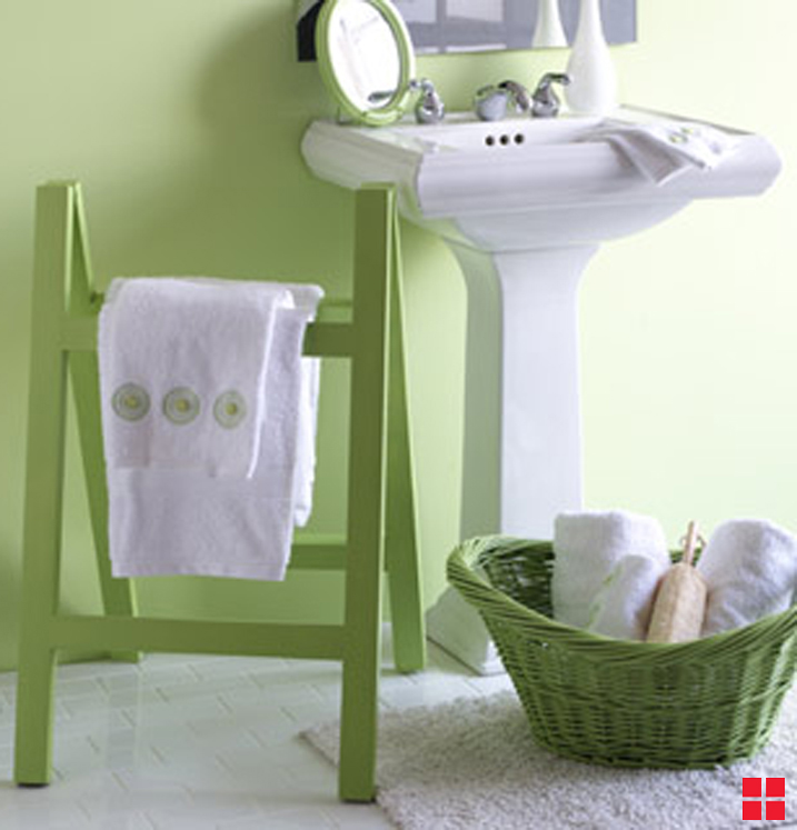 Green towel holder in bathroom