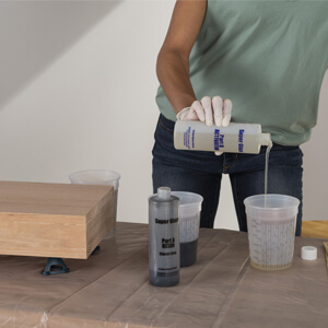 Pouring Varathane Tinted Super Glaze Activator Into Clean Cup
