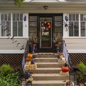 Decorative urns on either side of a front door.