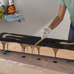 Spread Activated Mixture Over The Wood Shelf With A Wood Stir Stick Spreader