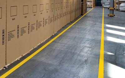 Yellow striping paint on factory floor