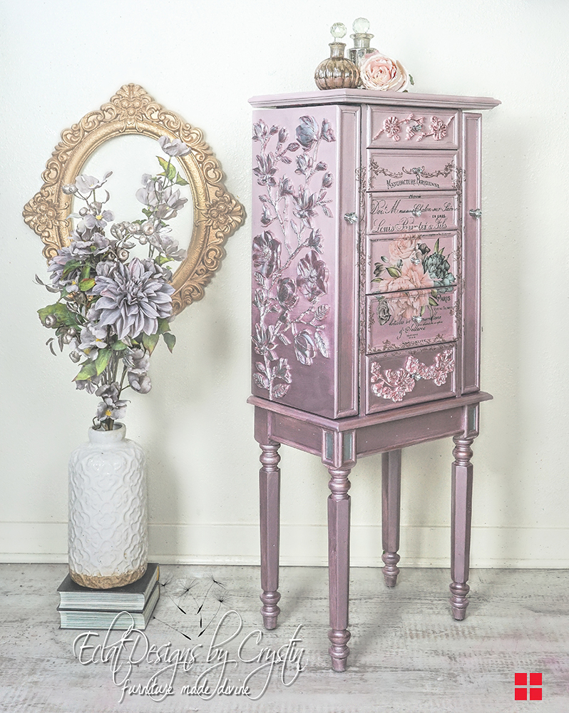 Jewelry armoire painted in different metallic paint shades.