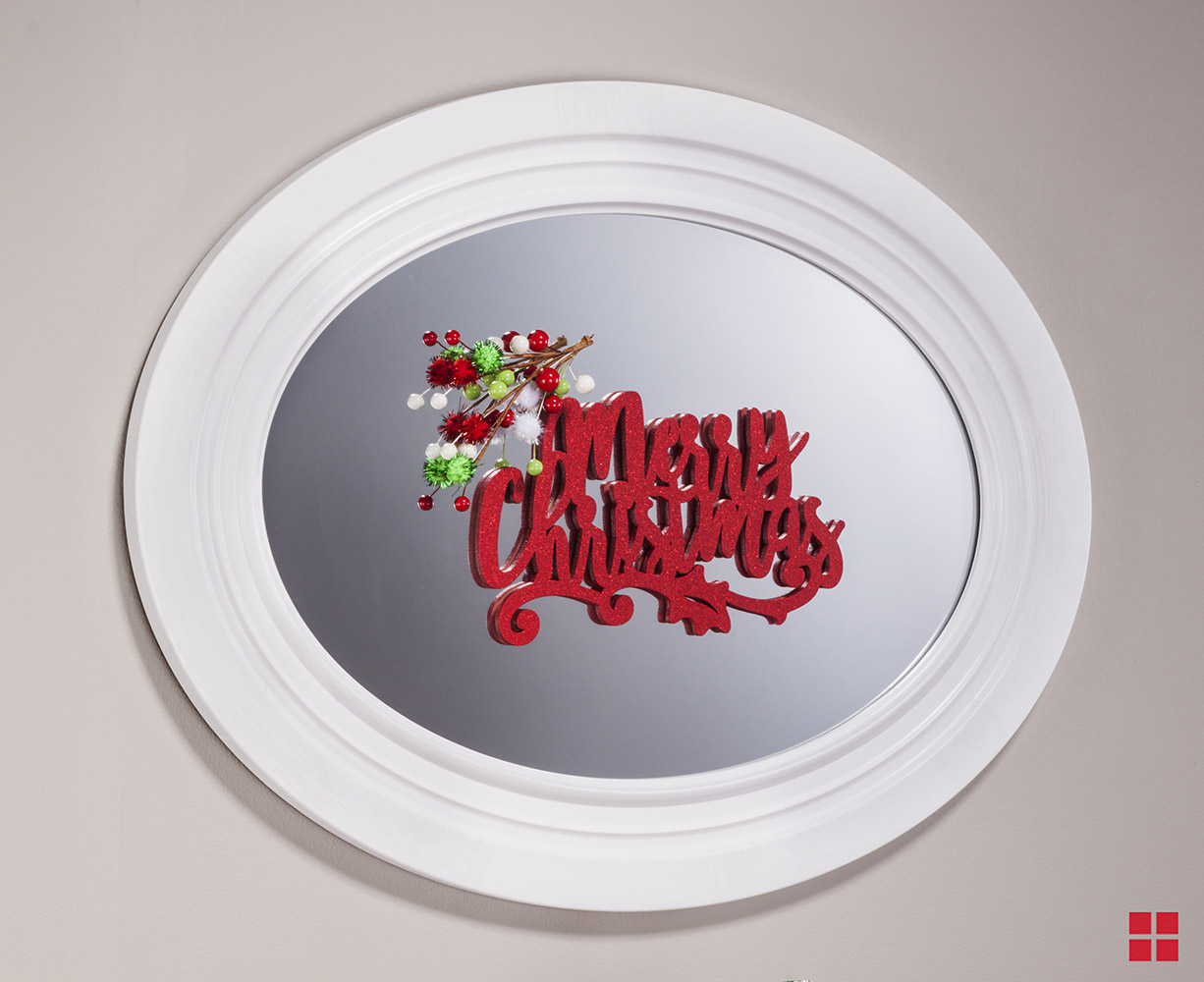 Spray painted Merry Christmas sign attached to a mirror.